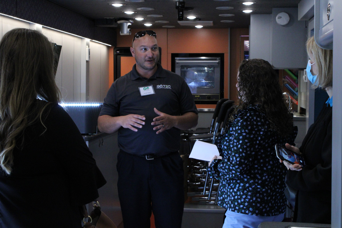 GO TEC Training Coordinator Jacob Taylor leads a tour of the program’s mobile technology lab.